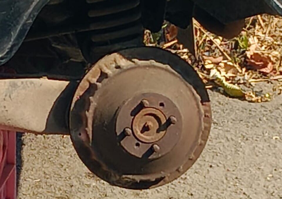 Rusted drum brake, the kind of corrosion regenerative braking pushes onto friction brakes