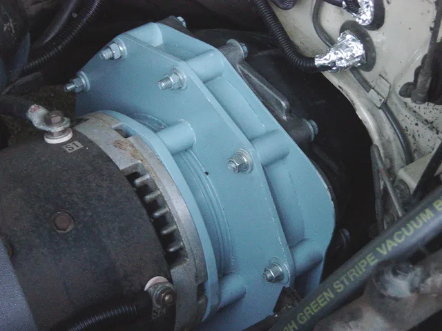 Adapter plate mating an electric motor to a classic car's original transmission